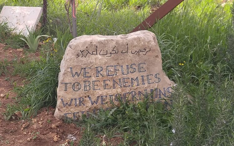 We Refuse to Be Enemies declaration at the entrance to the Tent of Nations.